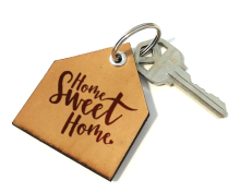 Image of a key on a keychain with a tag that says "Home Sweet Home"