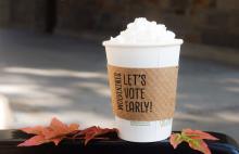 Image of a warm beverage and fall leaves