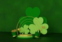 Image of shamrocks, a rainbow, and green hats.