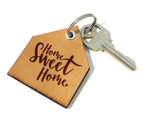 Picture of house key with keychain in the shape of a house that reads Home Sweet Home.