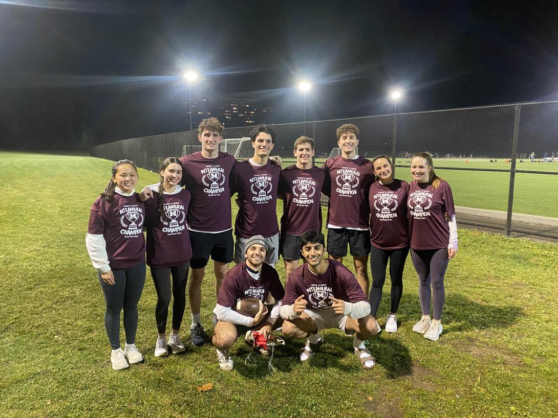 Photograph of students wearing Intramural Champion t-shirts.